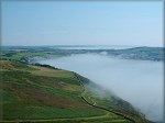 Mannanin's mist shrouds Port Erin Bay.