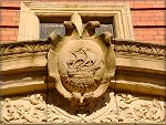 The crest above the door to the present day House of Keys.